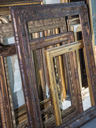 Stack of Golden Wooden Vintage Frames, Indoors.の写真素材