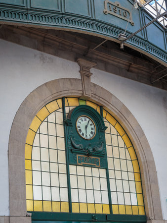 Public Train Station Building Interior Architecture: Historic Clock, Porto, Portugal.のeditorial素材