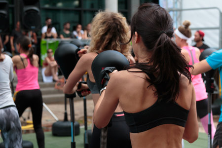 Girls in Fitness Class: Workout with Free Standing Boxing Punch Bag and Speed Ball.