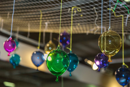 Multicolored Glass Balloons Hanging from the Ceiling.の写真素材