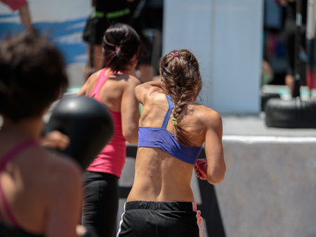 Fitness and Exercising Concept: Girls Workout with Speed Ball and Free Standing Boxing Punch Bag.の写真素材