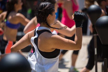 Fitness and Exercising Concept: Girls Workout with Speed Ball and Free Standing Boxing Punch Bag.のeditorial素材
