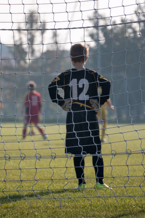 Little Soccer Player: Goalkeeper with Gloves in front of Goal.の写真素材