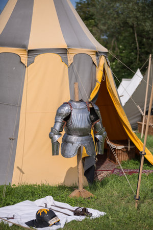 Medieval Metallic Armor and Ancient Tent in background.の写真素材
