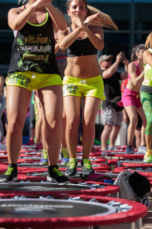 Mini Rebounder Workout: Girls doing Fitness Exercise in Outdoor Class at Gymのeditorial素材
