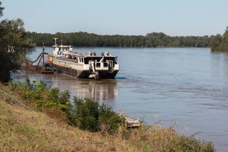 Abandoned Boat in River In Italy in Sunny Day