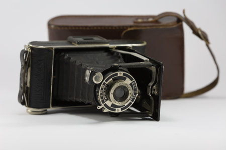 Ancient Folding Camera with Bellows and Brown Leather Case.