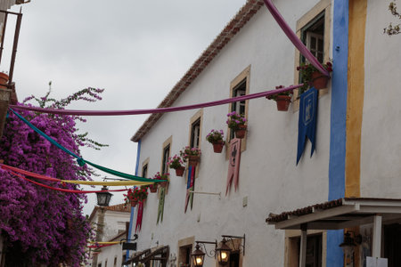 Colorful Facade and Narrow Street in the Medieval Portuguese City of Obidos.の写真素材
