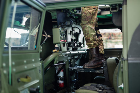 View of a Soldier Standing inside the Military Vehicle.の写真素材