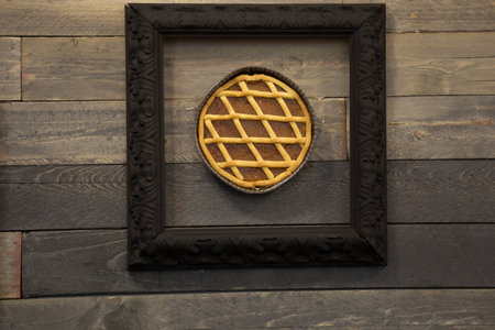Apricot Jam Tart in a Frame, Wooden Background.の写真素材