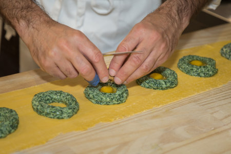 Preparation of Ravioli Italian Pasta with Spinach and Quail Eggs.の写真素材