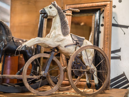 Antique Wooden Game: Rocking Horse with Three Wheels.の写真素材