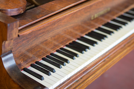 Ancient and Precious Wooden Piano: side view.の写真素材