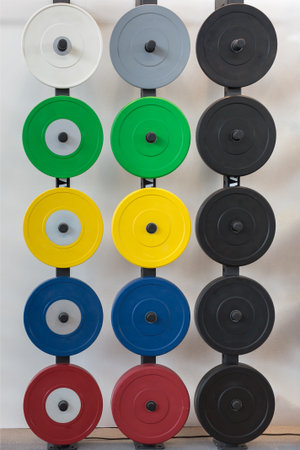 Iron Weight Plates in various Colors for Gym Barbells.の写真素材