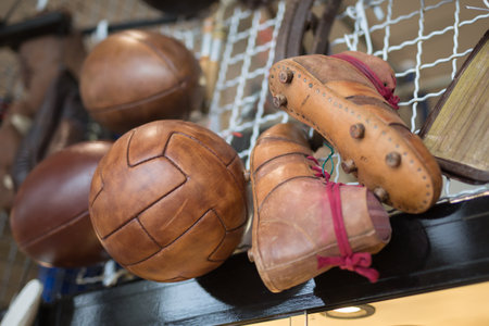 Vintage Brown Soccer Shoes and Antique Leather Soccer Ball.の写真素材
