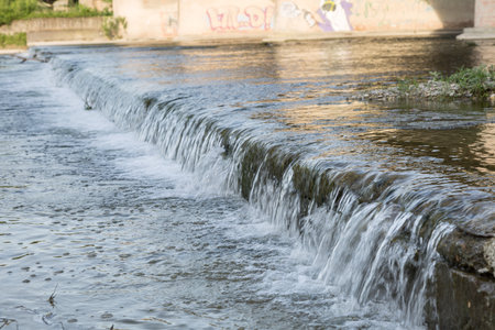 Water Flowing from the River in a Sunny Day.
