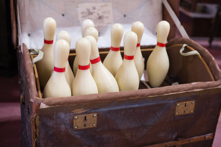 Set of White Bowling Pins inside an open Casket.の写真素材