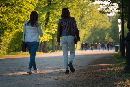 Teenagers Walking in a Public City Park.の写真素材