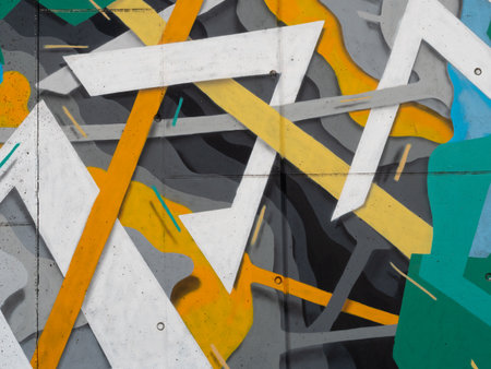 Abstract Painting on the Wall of a City with Yellow, Green, White and Orange Colors.の写真素材