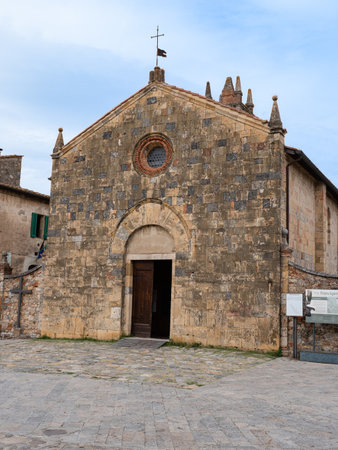 Church of Santa Maria Assunta in Piazza Roma in Monteriggioni, Siena - Italy.の写真素材
