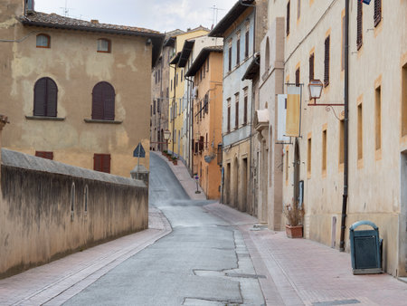 Typical Street with Ancient Houses in the Medieval Village of  San Gimignano, Siena - Italy.の写真素材