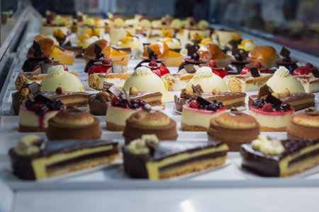 Pastries filled with Cream and Chocolate displayed in a pastry Shop Showcase.の写真素材