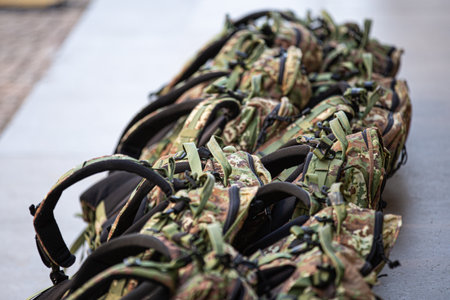 Set of Military Backpacks side by side in Line on the Ground.の写真素材