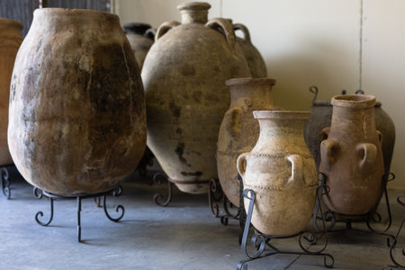 Group of Large Terracotta Garden Amphorae with Wrought Iron Supports at their Base.