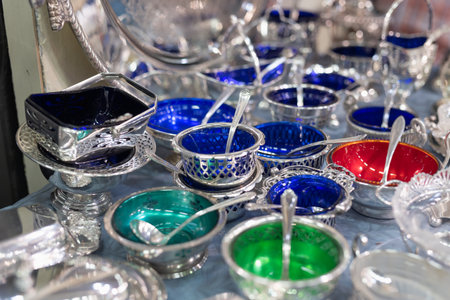 Silverware: Small Silver Vessels with Teaspoon Colored in Blue, Green and Red.の写真素材