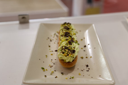 Savoy Cookie filled with Pistachio Cream and Walnut and Cocoa Granules.