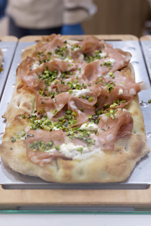Pizza Stuffed with Ham and Pieces of Cucumber.の写真素材