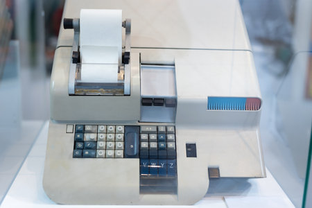 Antique Mechanical Calculator of Big Dimensions with Print of the Operations made on White Roll.