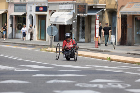 Athlete with its Special Bike on a City Track during a Race.