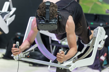Boy with Virtual Reality Visor Facing Immersive Experience with Floating Body Gear.