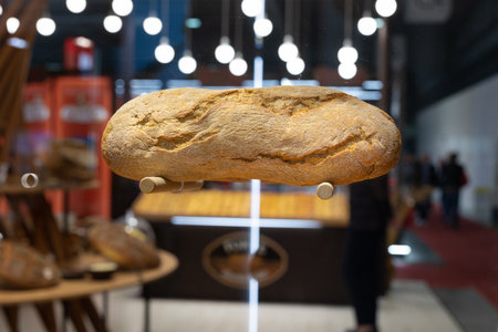 Classic Rustic Italian Loaf of Bread Resting on a Transparent Glass.