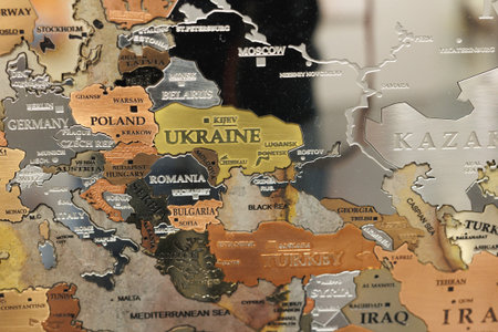 Geographic Map Made of Metallic Material with the Ukrainian territories in the Foreground.の写真素材