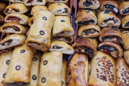 Group of Stuffed Sandwiches with Olives, Eggplant and Other Vegetables on the Counter for Sale.