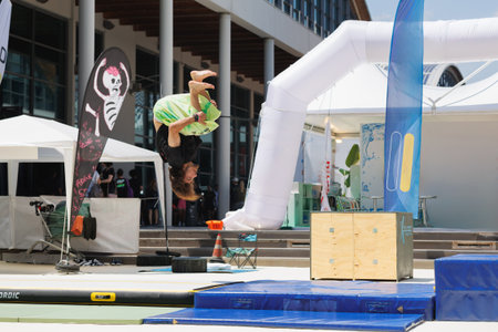 Boy training in the Discipline of Parkour with Rubber mats to Mitigate any falls.
