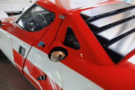Exterior View From the Driver's Seat Side of a Red Vintage Grand Touring Racing Car.