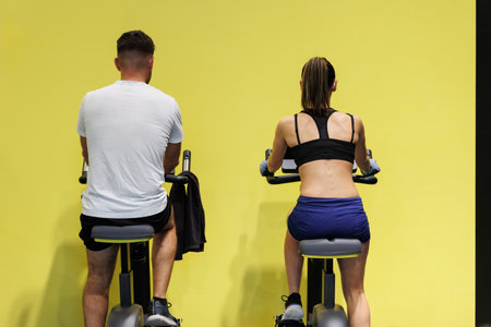 Couple Having Workout at Gym with Indoor Bikes.の写真素材