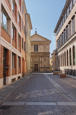 A Street in Parma and in the Background the deconsecrated Renaissance Church of San Marcellino, Italy.の写真素材