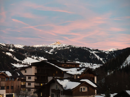 Sunset over the Mountains: Sky with Shades of Pink and Orange in Italian Dolomites Mountains Alps,...