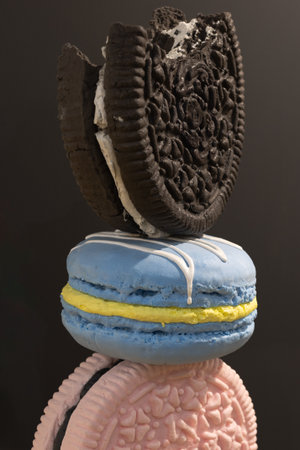 Artistic Representation of Three Different Colored Biscuits Arranged One Above the Other.