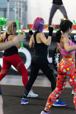 Fitness Workout at Gym: Exercises with Music and Green Drum Stick.の写真素材