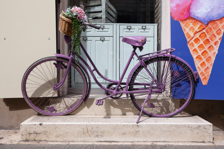 Vintage Purple Bicycle Adorned with Flowers.の写真素材
