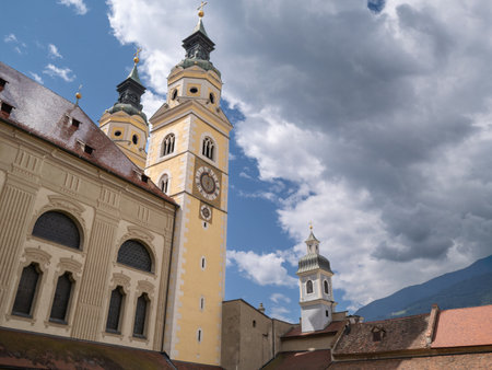 Historic Architecture of Bressanone Baroque Cathedral and Towers Against Blue Sky, Italy.の写真素材