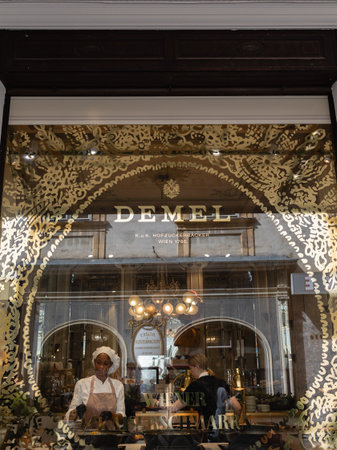 The Iconic Demel Cafe in Vienna, Workers seen from the storefront on the street, Austria.