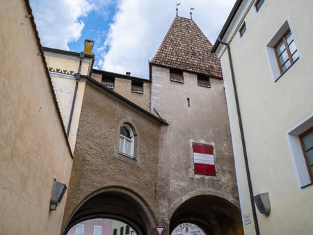 The Ancient Gateway Towering Over the Cobblestone Street in Bressanone,Sun Gate or Cross Gate - Italy.の写真素材