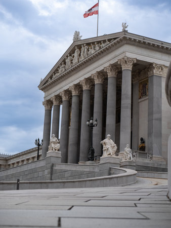 Facade of Neoclassical Parliament Building in Vienna with its Iconic Columns and Statues, Austria.の写真素材