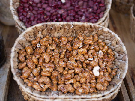 Golden Cashews and Crimson Beans in Wicker Basket.
